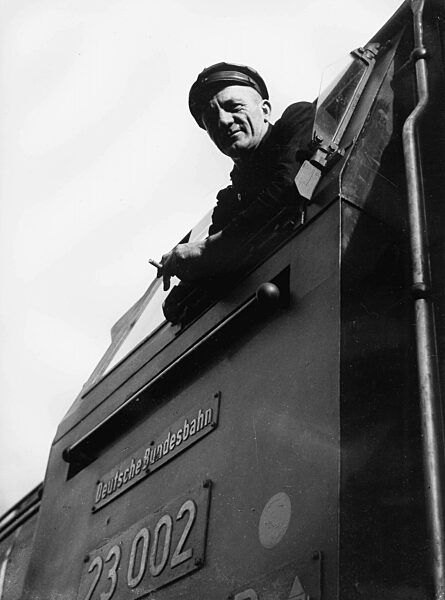 Engine driver on his steam locomotive, 1950