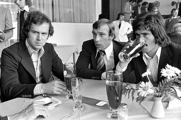 The 1974 FIFA World Cup: Beckenbauer, Hoettges, Mueller (GER)