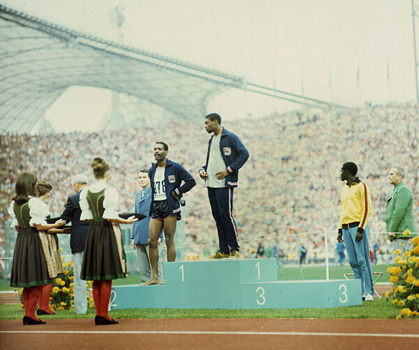 Olympic Games Munich 1972: Award ceremony 400m : Vince Matthews (gold) and Wayne Collett (silver/both USA) with disrespectful appearance at the award ceremony. Wayne Collett with barefoot. Right: Julius Sang (Kenya/Bronze) 07.09.1972.
