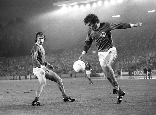 Soccer World Cup 1974 2nd round / BR Germany - Sweden 4:2 / 30.06.1974 in Duesseldorf / Paul Breitner in action, left Bernd Hölzenbein looks on