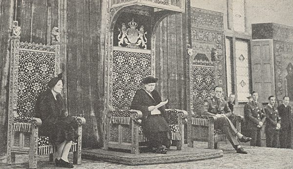 Queen Wilhelmina addresses the Dutch Parliament 1945. She is flanked by Princess Juliana and Prince Bernhard.