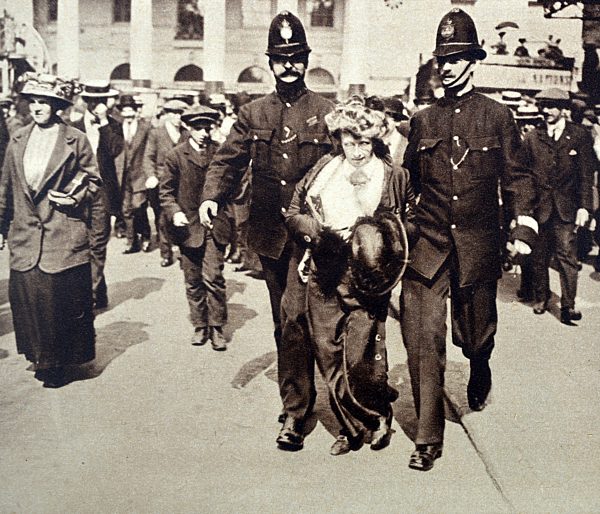 Photograph of a Suffragette in the hands of the Police