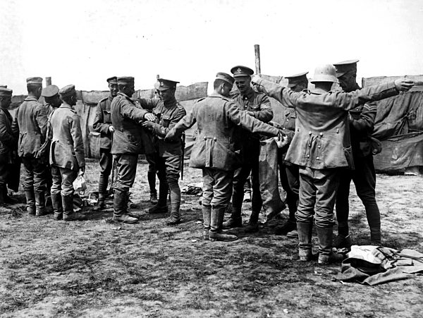 German prisoners being searched after capture at the commencement of the...