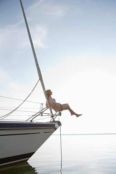 Girls sitting on front of boat