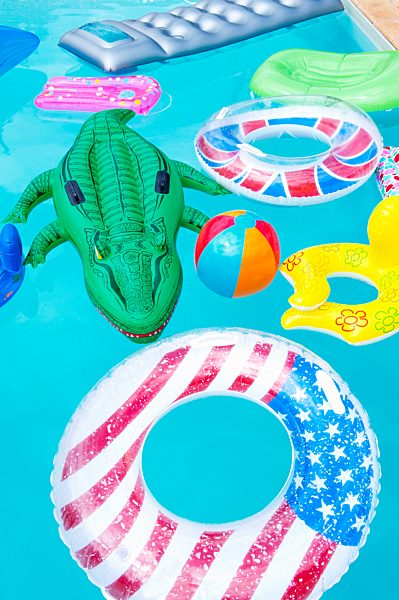 Air mattresses floating on swimming pool