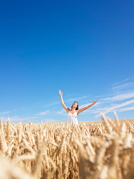young woman in wheat field