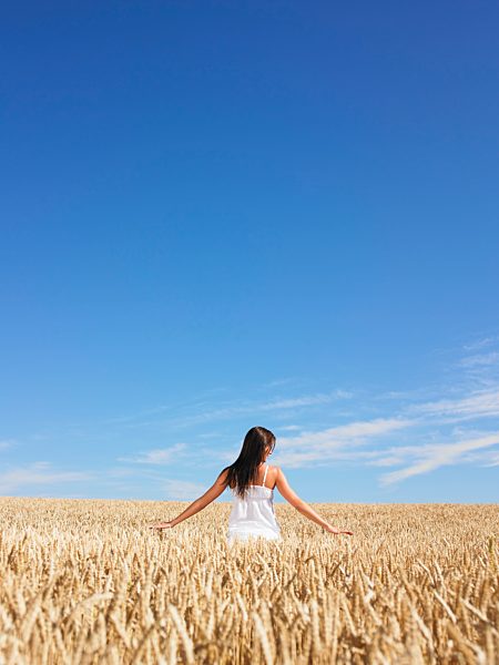 young woman in wheat field