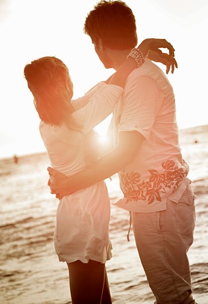 Couple hugging at beach