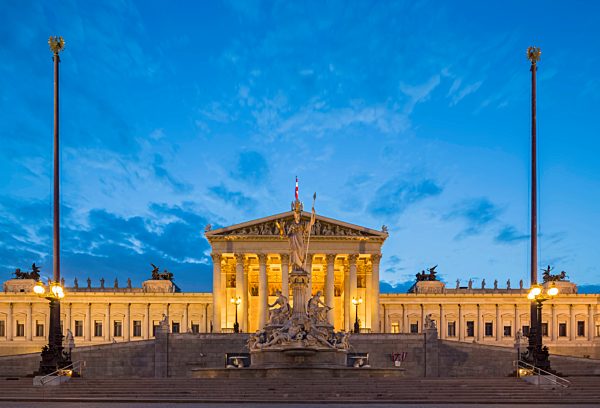 Austria, Vienna, view to parliament building with statue of goddess Pallas Athene in the foreground at blue hour