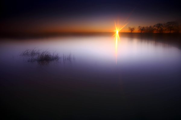 Spain, Castilla y Leon, Province of Zamora, Reserva natural de Lagunas de Villafafila, lake at sunset
