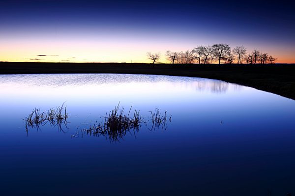 Spain, Castilla y Leon, Province of Zamora, Reserva natural de Lagunas de Villafafila, lake at sunset