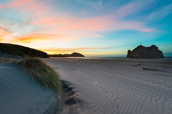 New Zealand, South Island, Puponga, Wharariki Beach at sunset