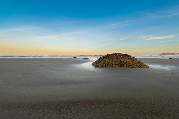 New Zealand, Otago coast, Moeraki Boulders on Koekohe Beach with sky at sunrise
