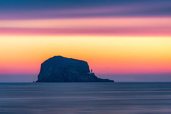 Great Britain, Scotland, East Lothian, North Berwick, Firth of Forth, view of Bass Rock at sunrise, lighthouse
