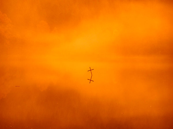 UK, Scotland, Loch Ard, Cross in water in the evening