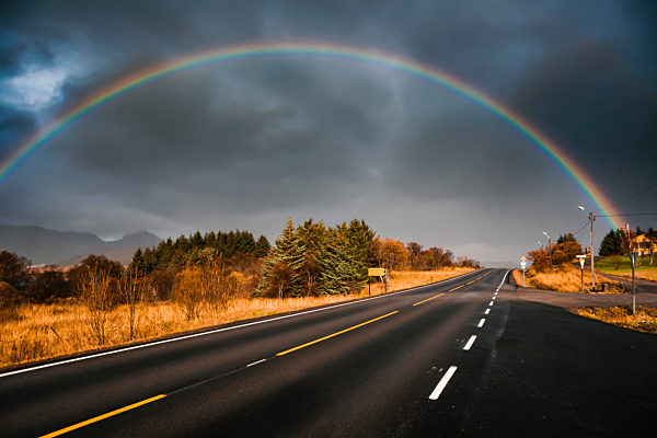 Norway, Lofoten Islands, Leknes, rainboy over empty street