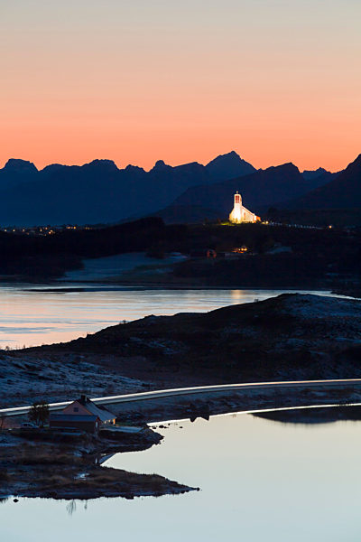 Norway, Lofoten Islands, Leknes, view to illuminated church