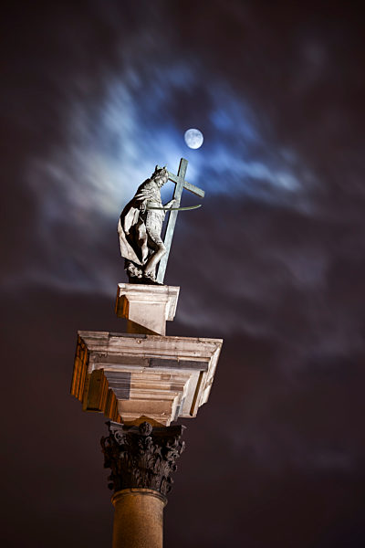 King Sigismund III Vasa statue at full moon night on top of Corinthian column, Warsaw, Poland