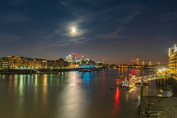 Skyline of London city with River Thames at full moon , London, UK