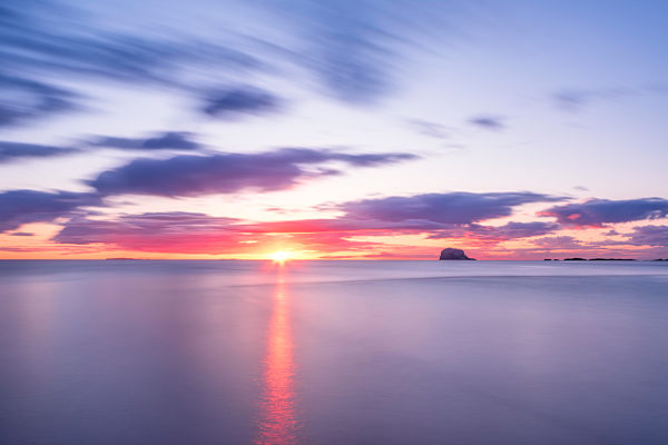 UK, Scotland, Firth of Forth at moody sunrise with silhouette of Bass Rock in background