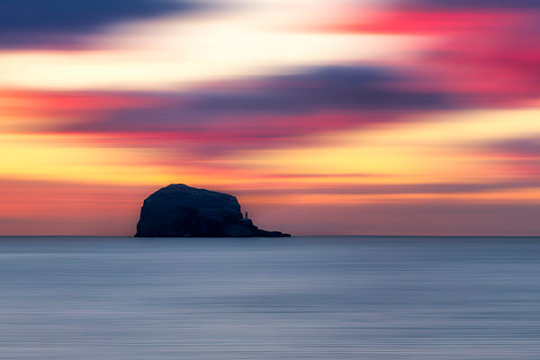 UK, Scotland, Firth of Forth at moody sunrise with silhouette of Bass Rock in background