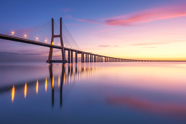 Portugal, Lisbon, Vasco da Gama Bridge at moody sunrise