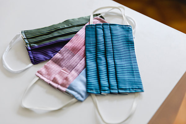 High angle view of colorful homemade face masks on table