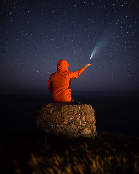 Man stargazing at Comet Neowise