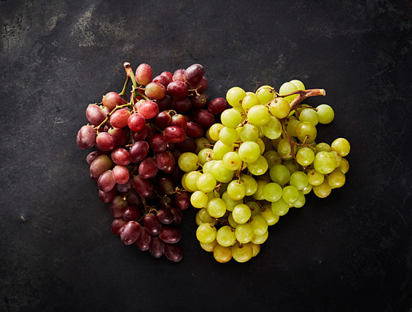 Studio shot of red and green grapes