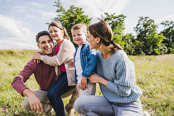 Children with by parents at meadow