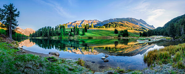 Reflection of mountain in Lai Da Palpuogna lake at  Graubunden, Switzerland