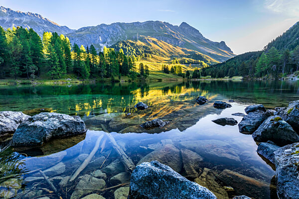 Reflection of mountain in water at Lai Da Palpuogna, Graubunden, Switzerland