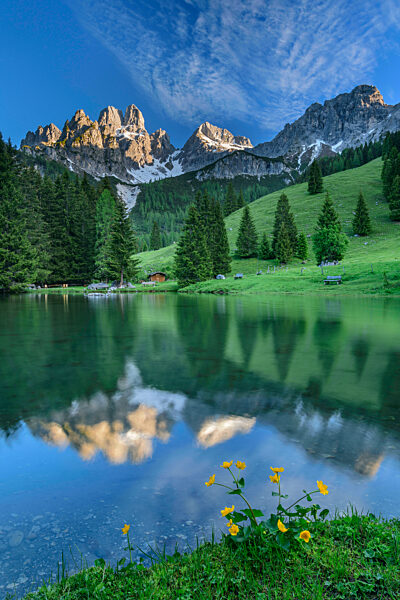Reflection of trees and mountains in water at Salzburg, Austria
