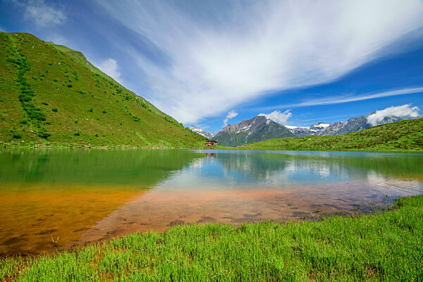 Scenic view of Berger See in spring with Bergerseehutte in distant background