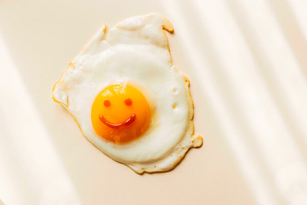 Fried egg with smiley face on yolk