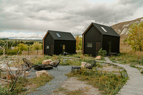 Tiny houses at rural landscape