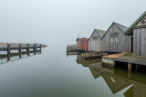 Germany, Mecklenburg-Western Pomerania, Zingst, Pier and row of coastal boathouses