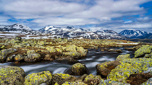 Norway, Innlandet, Long exposure of river flowing in Jotunheimen National Park