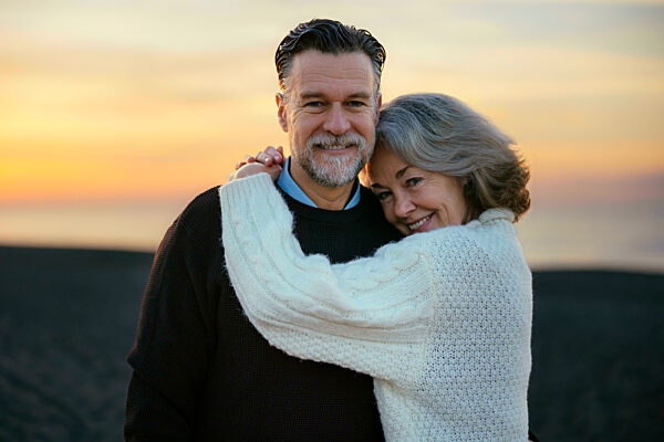 Happy mature couple enjoying at beach
