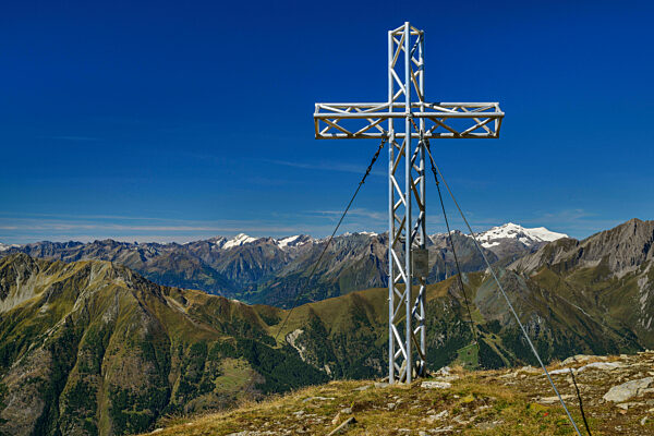 Summit cross on mountain in Hohe Tauern National Park, Austria