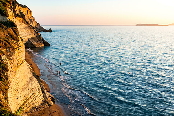 Greece, Ionian Islands, Ionian sea at sunset with cliffs in foreground