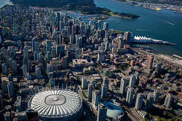 Canada, British Columbia, Vancouver, Aerial view of BC Place stadium and surrounding skyscrapers