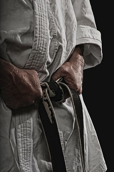 Germany, Bavaria, Mature man against black background, close up