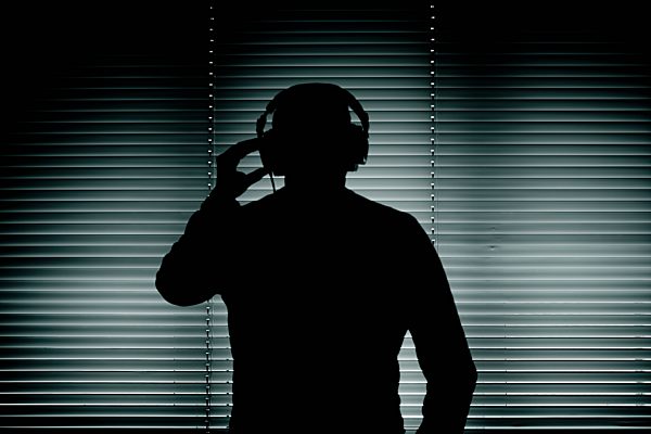 Germany, Bavaria, Man with head phone in recording studio