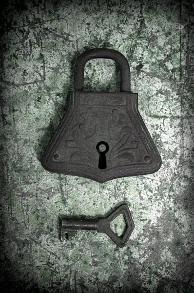 Old padlock and key, close up