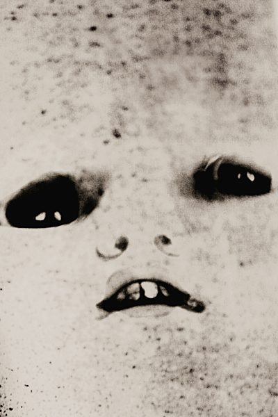 Creepy face of doll, close up