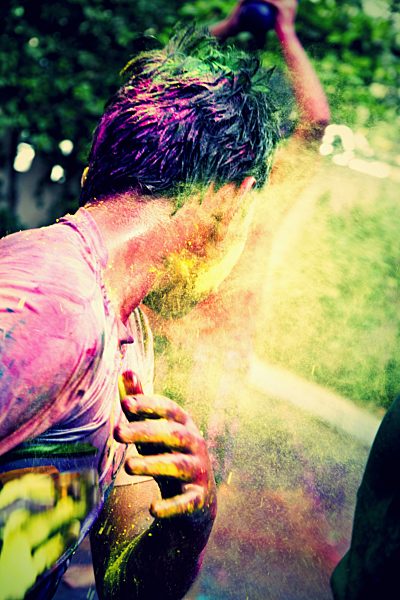 India, Ahmedabad, Young man celebrates Holi festival