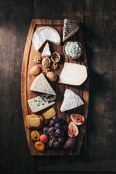 Cheese platter with fruits and nuts