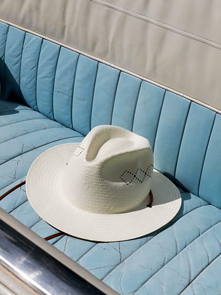 Germany, Hessen, Hat on seat of Vintage car, close up