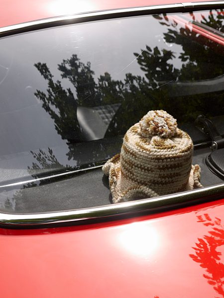Germany, Hesse, Vintage car with crocheted roll of toilet